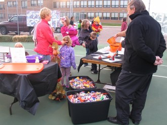 Dr. Theisen surveys the scene, guarding the candy